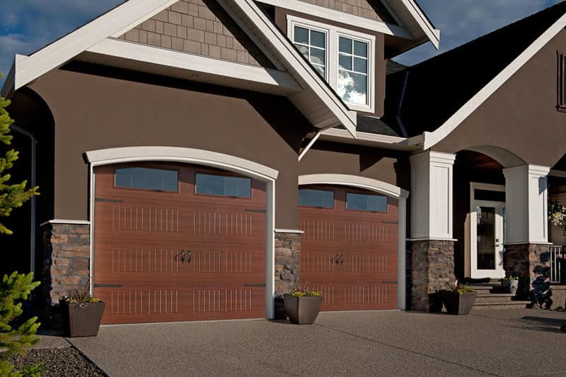 Elite residential garage door by Legacy Garage Doors in Kelowna, showcasing a modern design with sleek, horizontal panels