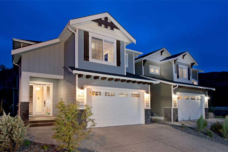 RanchCraft residential garage door by Legacy Garage Doors in Kelowna, featuring a sleek, rustic design with wood grain finish