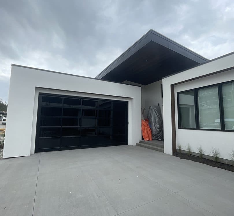 Esteem garage door with dark tint and privacy glass by Legacy Garage Doors