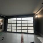 Esteem garage door with dark tint and privacy glass, inside and outside view by Legacy Garage Doors