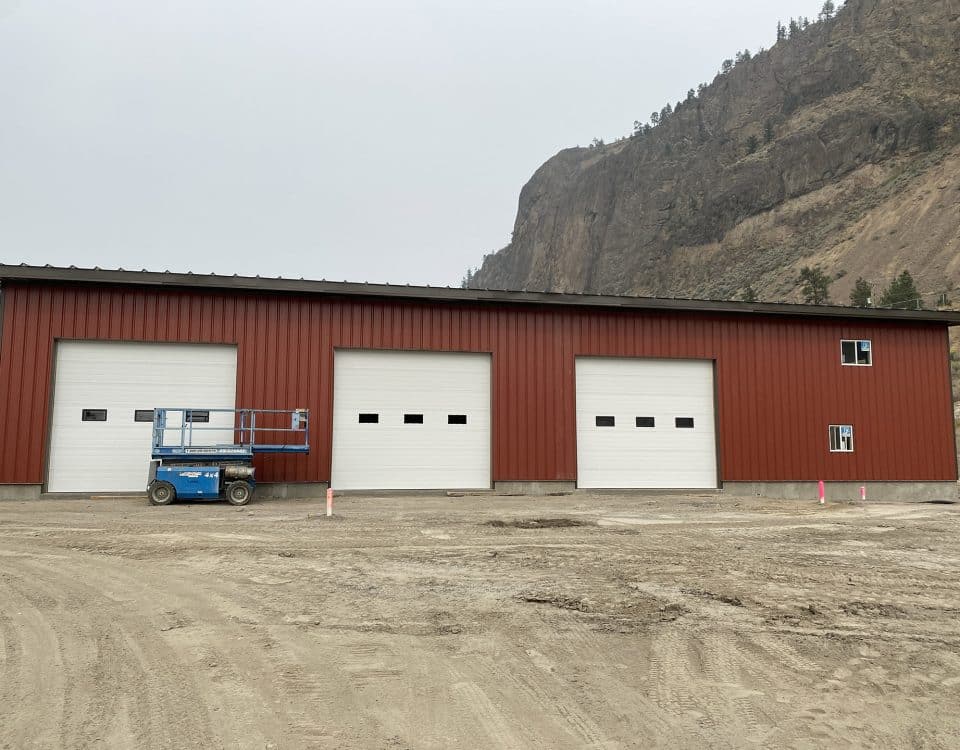 16x14-foot steel garage door featuring evenly spaced glass panels for a modern commercial building design