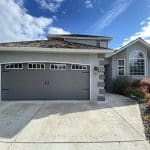 16x7-foot carriage-style garage door in sable grey, featuring a classic design with paneling for residential use