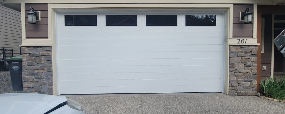 Mid-century modern white garage door with top panel clear glass by Legacy Garage Doors