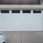 Mid-century modern white garage door with top panel clear glass by Legacy Garage Doors