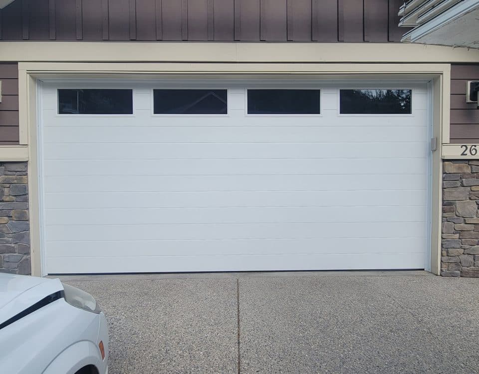 Mid-century modern white garage door with top panel clear glass by Legacy Garage Doors