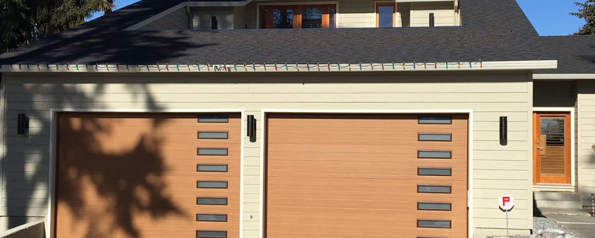 Close-up of brown garage doors installed by Legacy Garage Doors