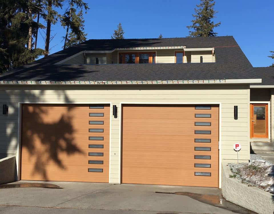 Close-up of brown garage doors installed by Legacy Garage Doors