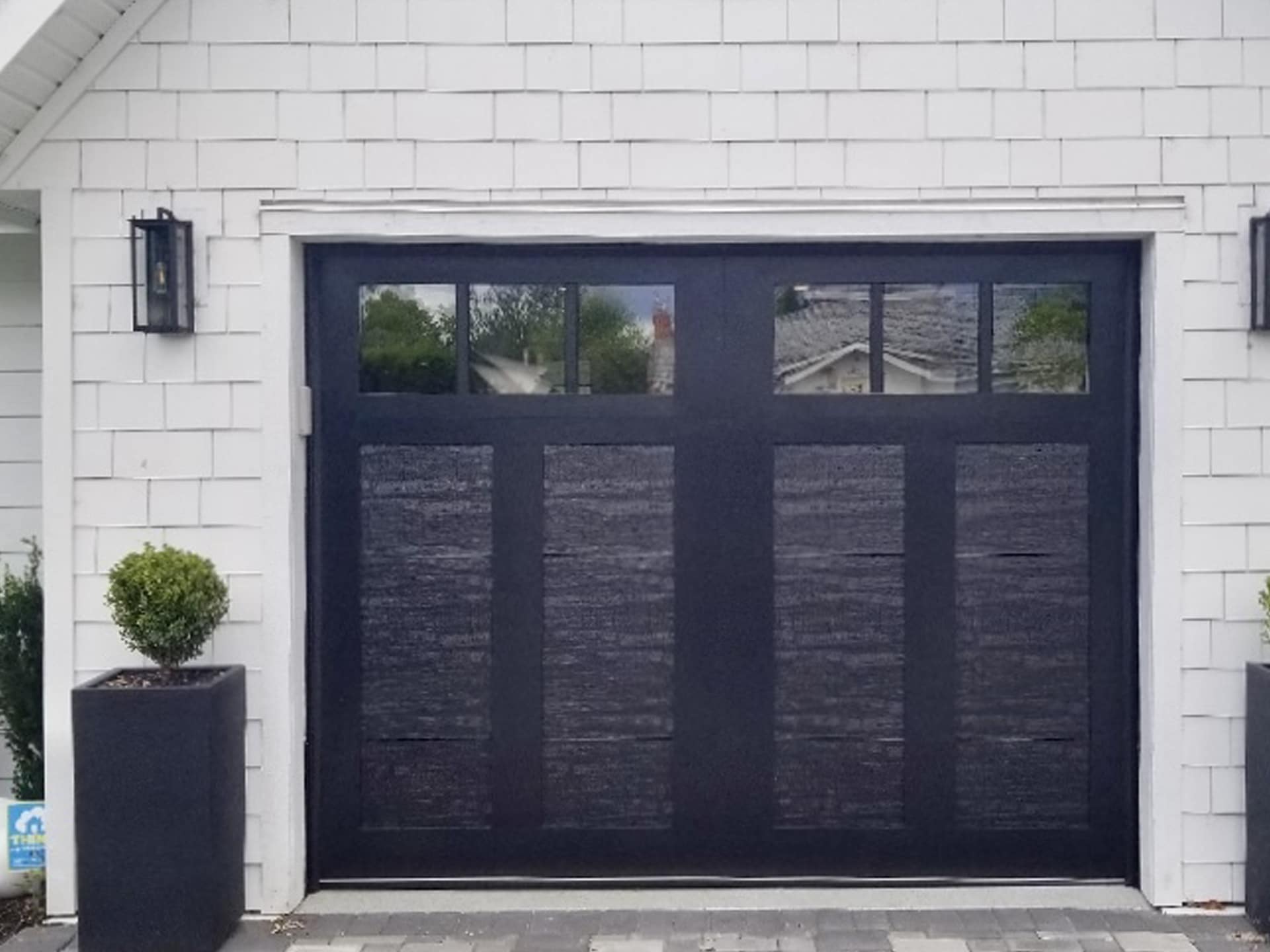 Clopay After garage door showcasing an updated style with a modern finish and clean lines