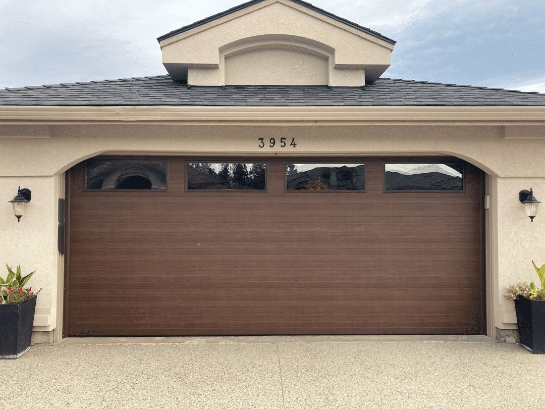 Contemporary Walnut After garage door featuring an updated finish with a modern walnut design and sleek appearance