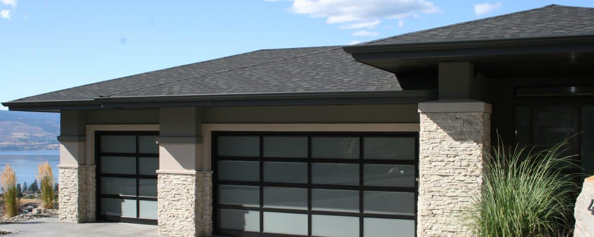 Glass windows in a garage door installed by Legacy Garage Doors