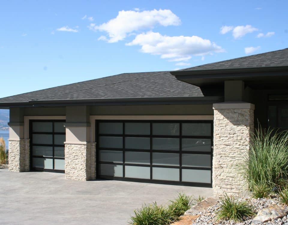 Glass windows in a garage door installed by Legacy Garage Doors