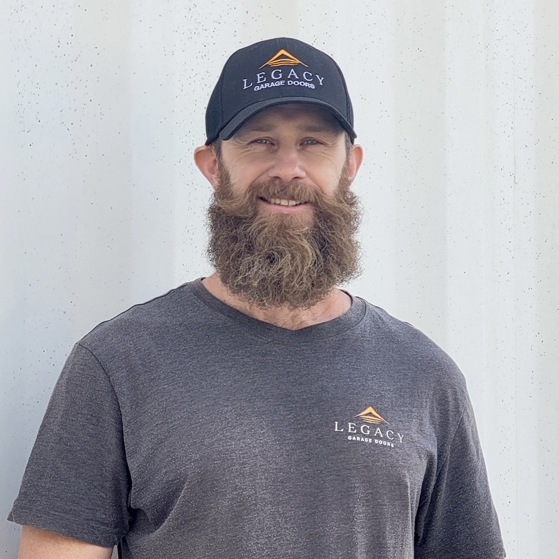 Headshot of Jesse with a professional look, featuring a friendly smile wearing company shirt