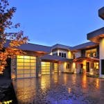 Garage door installed by Legacy Garage Doors, illuminated at night