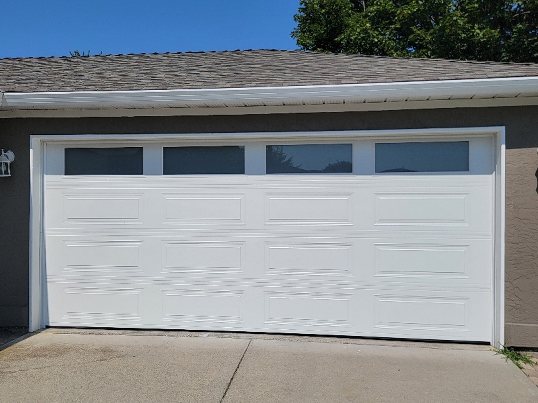 SC Flush After garage door featuring clean lines and a modern design with a textured finish