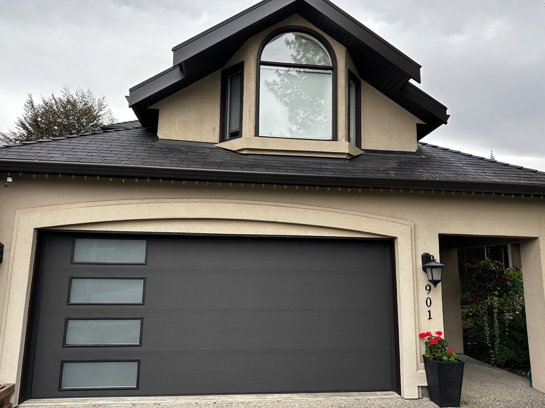 SC Flush Charcoal After garage door with a sleek charcoal finish and modern design updates